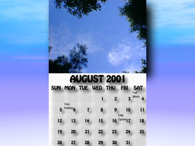 August 2001 calendar. The sky over the forest beside McDonald Lake turns a dark shade of blue.